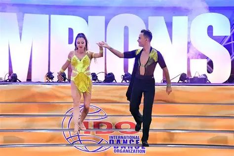 a pic of dancing couple on a stage